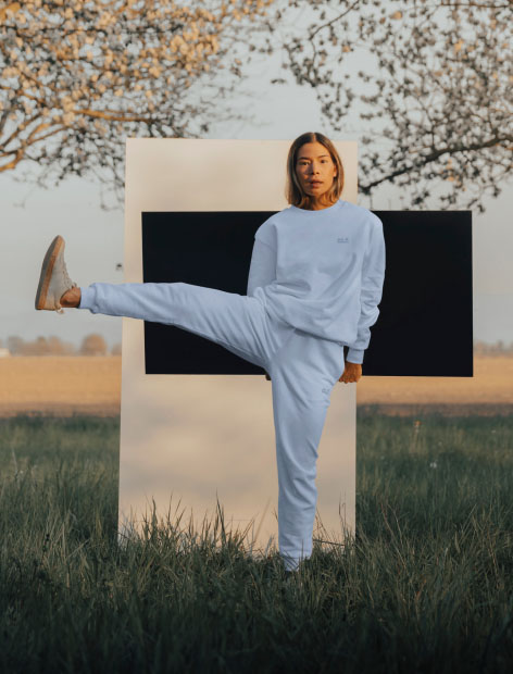 Woman lifting her leg out to the side