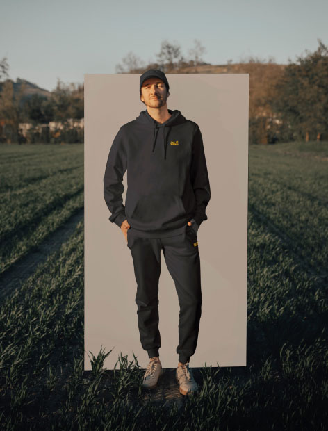 Man standing with hands in his pockets