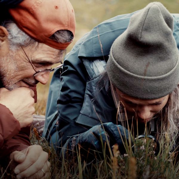 Father and daughter with a magnifying glass