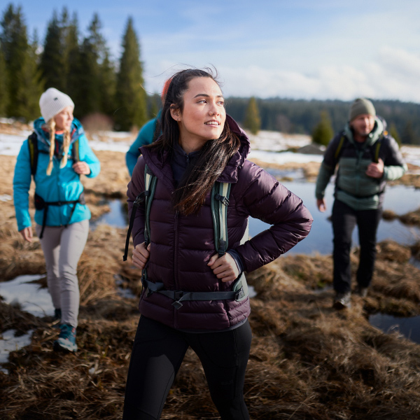 Four hikers in front of a lake view